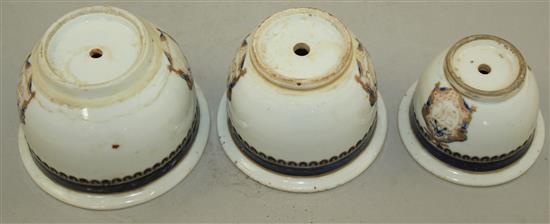 An unusual set of three graduated Chinese export enamelled porcelain flower pots, early 19th century, largest 11.5cm